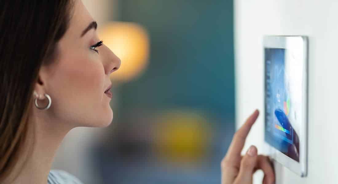 home automation Vero Beach Florida woman using control panel