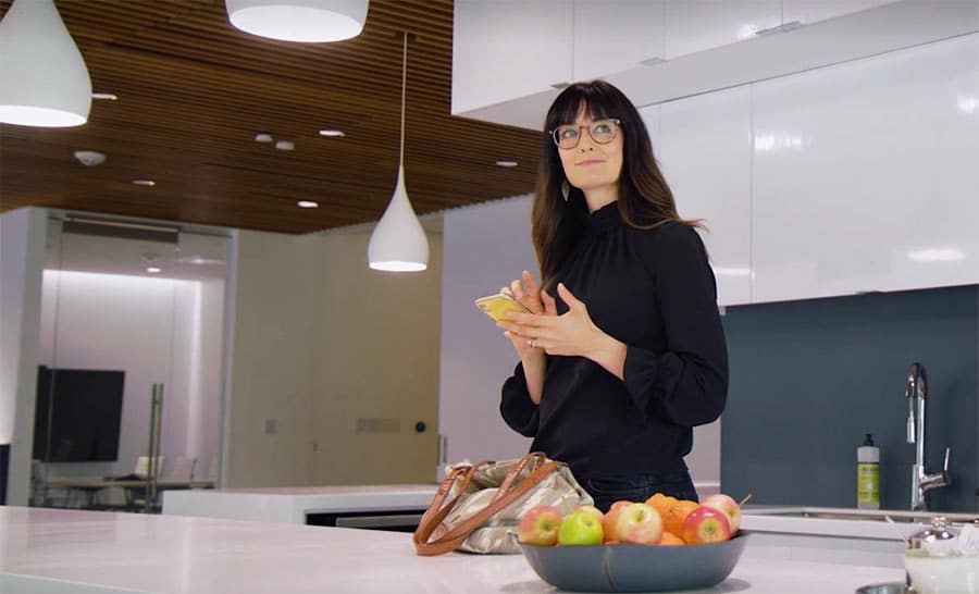 Woman using the Lutron app